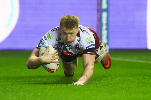 Zach Eckersley scoring a try for Wigan Warriors