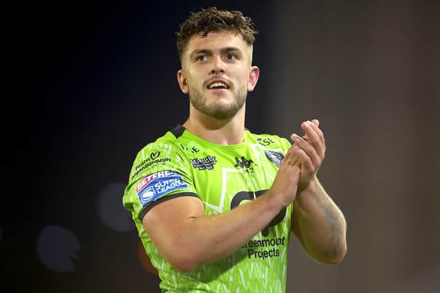 Brad O'Neill applauds the Wigan Warriors fans