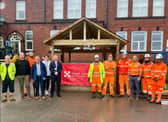 Business representatives and Coun Lol Hunt (front row third left) outside the new wellbeing zone at Mab's Cross Primary School