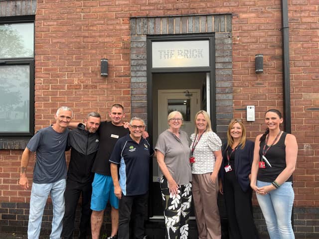 Representatives from Wigan Council and The Brick with Queen's Arms residents, including Dean Paul