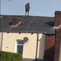 Carjacking and dangerous driving are among charges against a Wigan man arrested after a rooftop stand-off