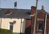 Emergency services descended on Lord Street, Hindley, when a man took to the roof of a property there