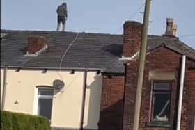 Emergency services descended on Lord Street, Hindley, when a man took to the roof of a property there
