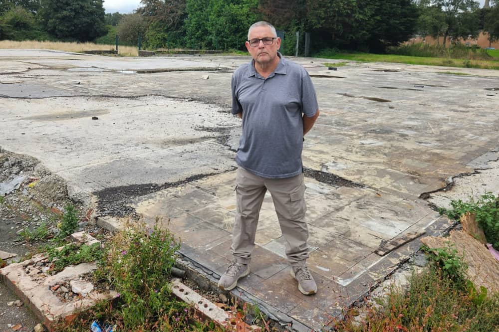 Coun Chris Ready at the former Whelley Labour Club site