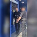 Wayne Kelly in handcuffs just after paedophile hunters made a citizens' arrest at Wigan North Western