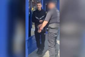 Wayne Kelly in handcuffs just after paedophile hunters made a citizens' arrest at Wigan North Western