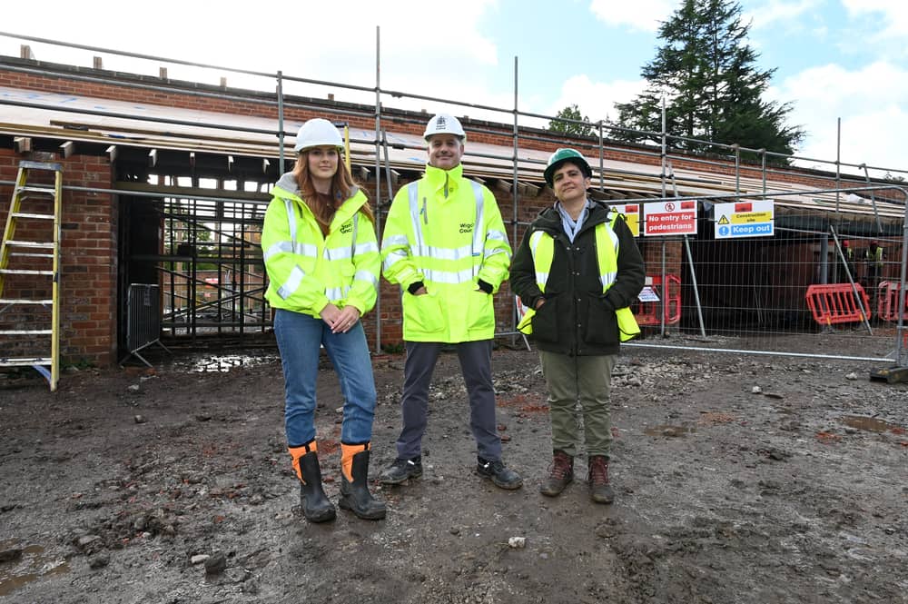 Construction project manager Ellie Colling, operations director Peter Hughes and Dr Sylvia Travers, head of  horticulture and landscape, outside the bothy at Haigh Woodland Park
