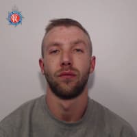 A man with links to Wigan is wanted by police on recall to prison