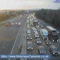 M6 partially reopens but long delays remain between junctions 32 and 33 after lorry crashes into van