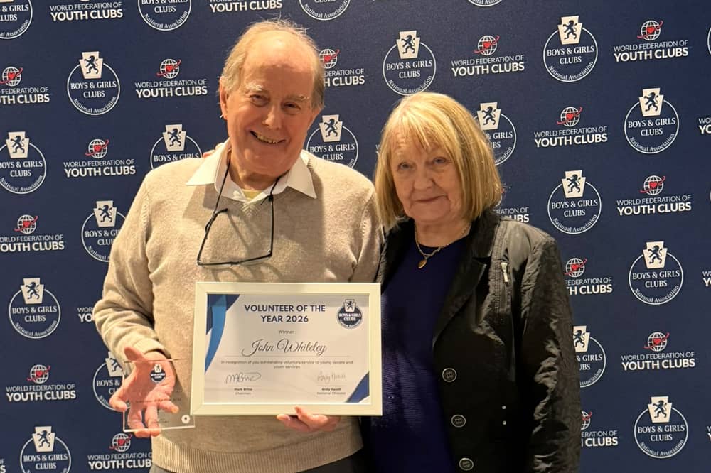 John Whiteley receives the award with his wife Ira