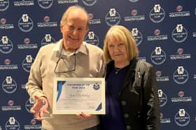 John Whiteley receives the award with his wife Ira
