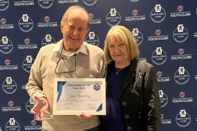 John Whiteley receives the award with his wife Ira