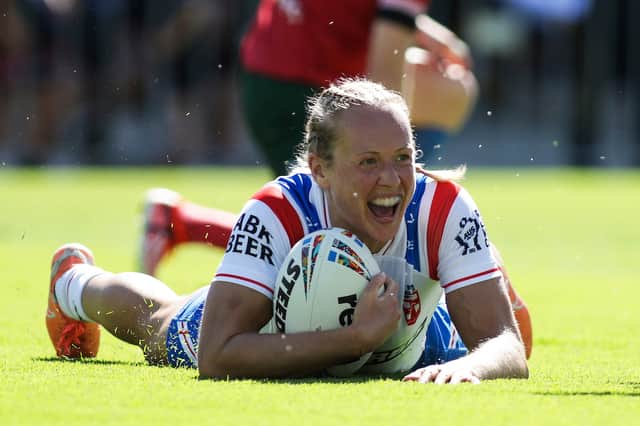 Anna Davies scoring a try in England's win over Wales