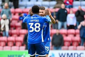 Christian Saydee congratulates goalscorer Scott Hogan as Latics saw off Reading
