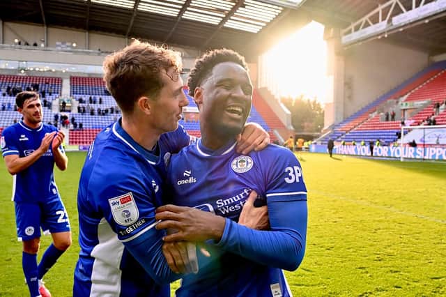 Christian Saydee celebrates his return to the side with Jensen Weir