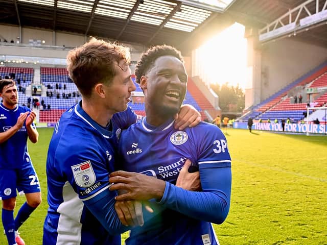 Christian Saydee celebrates his return to the side with Jensen Weir