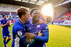 Christian Saydee celebrates his return to the side with Jensen Weir