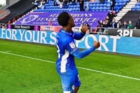 Christian Saydee celebrates a big three points with the Latics fans