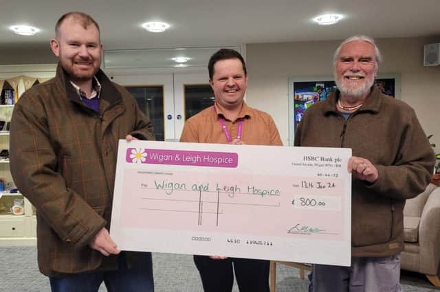 A cheque presentation to the hospice. John Vickers is on the right