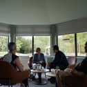 Andy Burnham and John Vickers (right) during a visit to Wigan and Leigh Hospice