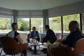 Andy Burnham and John Vickers (right) during a visit to Wigan and Leigh Hospice