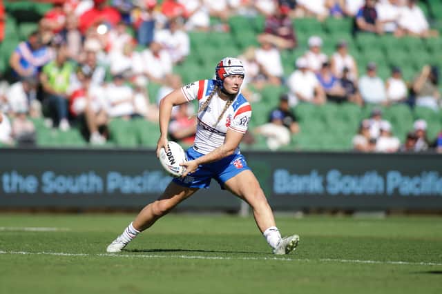 Wigan Warriors star Izzy Rowe in action for England against Wales