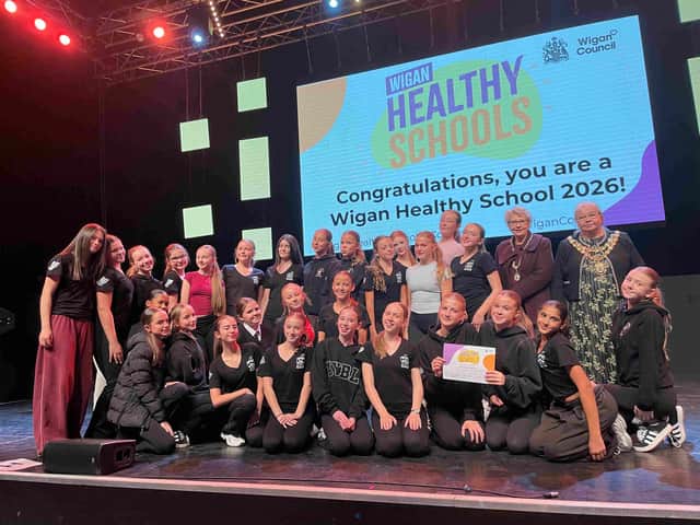 Dancers from Fred Longworth High School receive their Healthy School certificate from the Mayor
