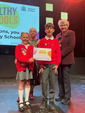 Pupils from Sacred Heart Wigan receive their certificate from the Mayor, Cllr Anne Collins