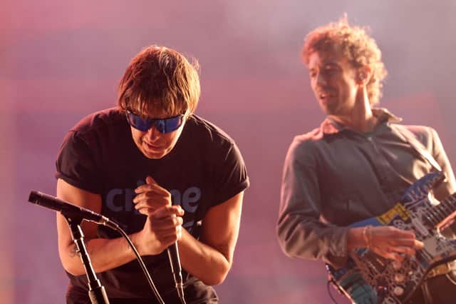 US singer/songwriter Julian Casablancas and guitarist Albert Hammond Jr. from the Strokes perform during Coachella 2026.