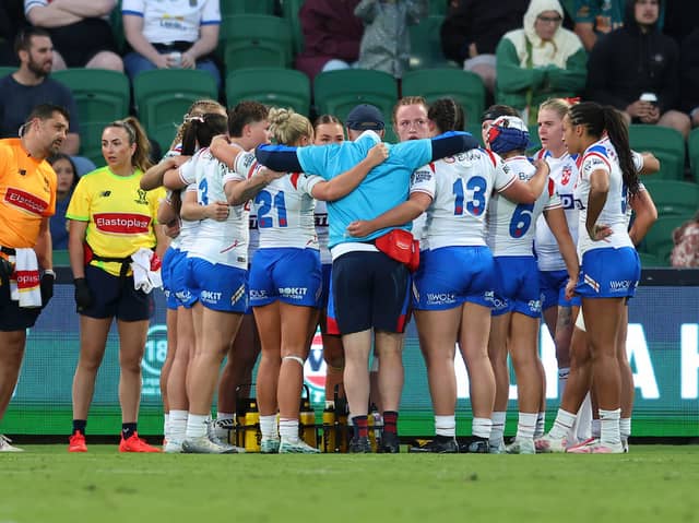 England players in a huddle during their defeat to Australia