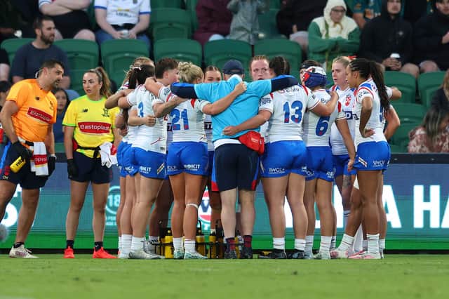 England players in a huddle during their defeat to Australia