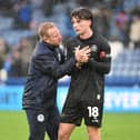 David Perkins consoles Charlie Gray after Latics' defeat at Huddersfield
