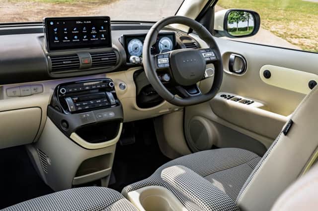 Physical controls and twin 10.25-inch displays make the dashboard a practical mix of buttons and technology