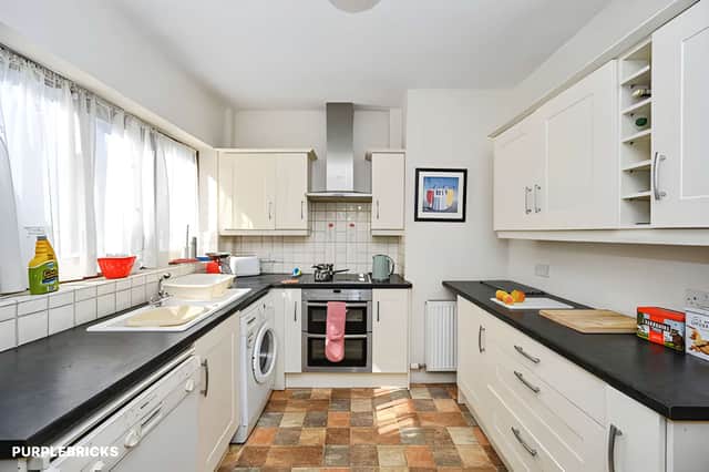 The separate kitchen complements the home's two reception rooms and practical ground-floor layout.