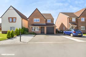 The detached home on Chapman Close has a driveway leading to the garage, providing off-road parking and useful additional storage.