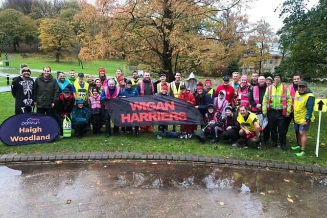 Volunteers and participants from Wigan Harriers at last year's Halloween Haigh Woodland parkrun