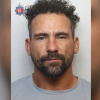 Police are searching for a man wanted for offences including burglary who has links to Wigan