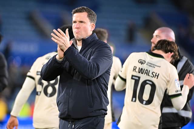 Gary Caldwell applauds the Wigan Athletic supporters following their defeat at Leicester City