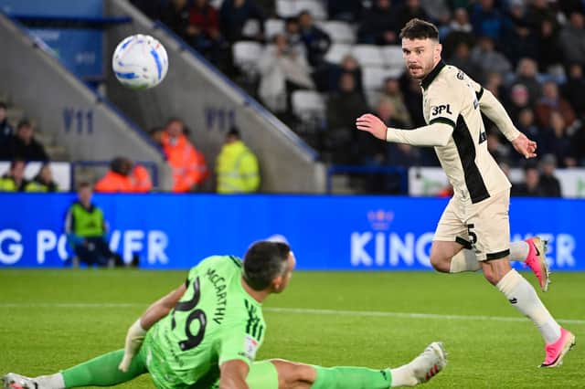 Wigan Athletic striker Scott Hogan in action against Leicester City