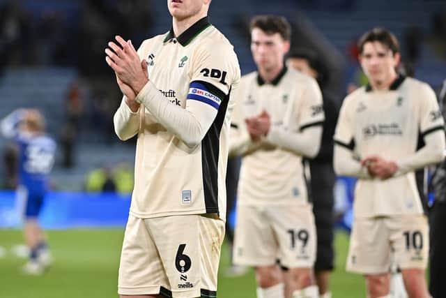 Jensen Weir applauds the Wigan Athletic fans following Tuesday’s defeat at Leicester City