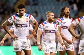 Kai Pearce-Paul (left), Luke Thompson (centre) and Dom Young (right) dejected despite victory over PNG as England face a group stage exit from the Rugby League World Cup