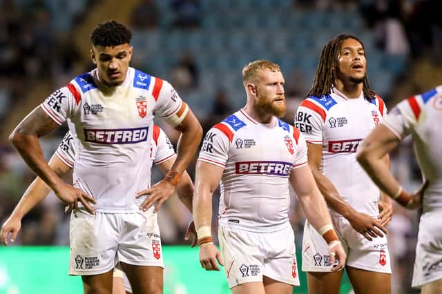 Kai Pearce-Paul (left), Luke Thompson (centre) and Dom Young (right) dejected despite victory over PNG as England face a group stage exit from the Rugby League World Cup