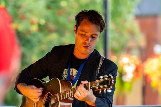 Joe Astley singing at the Save The Bull Chophouse fundraiser