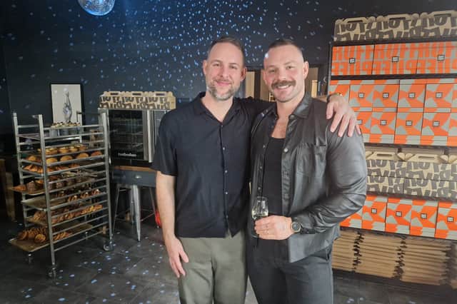 John Whaite (right) with husband Paul at the new Ruff Puff Bakehouse