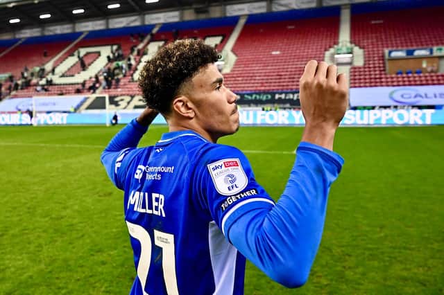 K'Marni Miller celebrates with the Latics fans after the win over Bromley