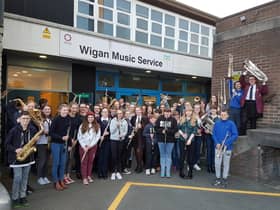 Wigan Youth Orchestra assembled outside the music service's base in Hindley