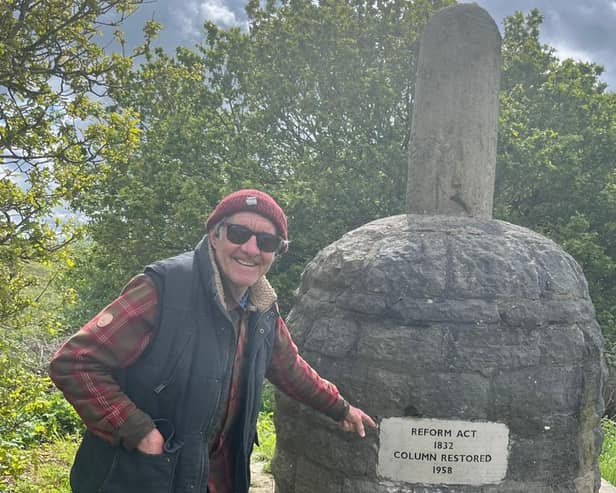 Ken points to the renewed inscription