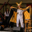 The Dirt Poets performing Searching for Sun Ra at Seek Out Festival: Peter Shukie (words), with Paul Nataraj (sound) and Rebecca Taylor Murray (visuals). Shukie wears Sun Ra inspired headgear created from a miner’s helmet, linking the performance to Wigan