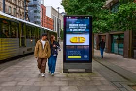 A digital advert on Aytoun Street, Manchester, highlighting parents' support for free school meals for all. The NEU has launched 22 billboards across Manchester and Wigan