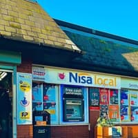 A Wigan convnience store celebrates a £45k milestone with new funding for a local football club